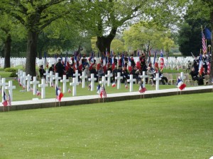 U.S. Cemetery St James, Normandy. The veterans sit quietly under the trees, remembering fallen comrades so long ago. Every year, the number of veterans gets smaller.