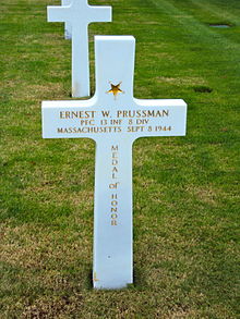 The gravestone of Ernest W Prussman, recipient of the Medal of Honor, Saint James Cemetery Normandy.